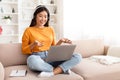 Young asian woman have online lesson, using laptop at home Royalty Free Stock Photo