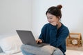 Young asian woman having conversation chatting while using laptop at house. Work at home, Video conference, Online Royalty Free Stock Photo