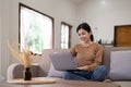 Young asian woman having conversation chatting while using laptop at house. Work at home, Video conference, Online Royalty Free Stock Photo
