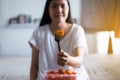 Young asian woman having fresh fruits papaya slice,Concept healthy food Royalty Free Stock Photo