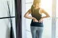 Young asian woman having waist or flank pain,Female feeling exhausted and painful Royalty Free Stock Photo