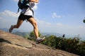 Young asian woman hiker running on mountain peak Royalty Free Stock Photo