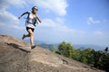 Young asian woman hiker running on mountain peak Royalty Free Stock Photo