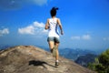 Young asian woman hiker running on mountain peak Royalty Free Stock Photo