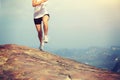 Young asian woman hiker running on mountain peak Royalty Free Stock Photo