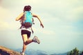 Young asian woman hiker running on mountain peak Royalty Free Stock Photo