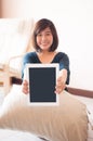 Young asian woman holding blank digital tablet. Royalty Free Stock Photo