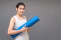 Young asian woman holding her yoga mat Royalty Free Stock Photo
