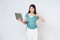 Young asian woman holding a laptop and showing thumbs up isolated on white background Royalty Free Stock Photo