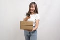 Young asian woman holding paper box and cardbord box over white background, Save earth and delivery concept Royalty Free Stock Photo