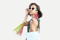 Young Asian woman holding shopping bag and credit card white isolate isolate background Royalty Free Stock Photo