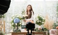 Young Asian woman in home make an online presenting and live broadcast for sale her flowers delivery online. Royalty Free Stock Photo