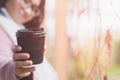 Young asian woman with hot drink Royalty Free Stock Photo