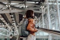 Young asian woman in international airport terminal or modern train station Royalty Free Stock Photo