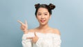 Young asian woman isolated excited pointing with forefingers away Royalty Free Stock Photo