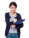 Young asian woman jot down the memo on file board Royalty Free Stock Photo