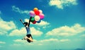 Young asian woman jumping with colored balloons Royalty Free Stock Photo
