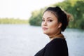 Young asian woman by the lake Royalty Free Stock Photo