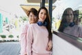 Young asian woman LGBTQ lesbian couple have fun in their journey on vacation day in the urban