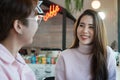Young asian woman LGBTQ lover talking and smiling together happily in business owner coffee shop