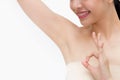 Young Asian woman lifting hands up to show off clean and hygienic armpits or underarms and giving okay sign Royalty Free Stock Photo