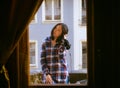 Young Asian woman listen to music on balcony Royalty Free Stock Photo