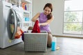 Young Asian woman loading the laundry Royalty Free Stock Photo