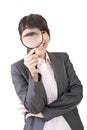 Young asian woman looking through a magnifying glass Royalty Free Stock Photo