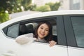 Young asian woman looks out of the car window Royalty Free Stock Photo