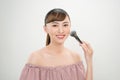 Young asian woman  makeup brush. Make up and beauty treatment concept shoot Royalty Free Stock Photo