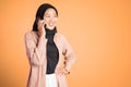 happy asian woman making a call using a cell phone Royalty Free Stock Photo