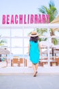 Young asian woman at outdoor beach library Royalty Free Stock Photo