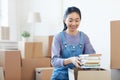 Young Asian Woman Packing Boxes Royalty Free Stock Photo