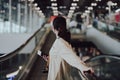 Young asian woman passenger in airport terminal or modern train station Royalty Free Stock Photo
