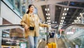 Young asian woman passenger in airport terminal or modern train station Royalty Free Stock Photo