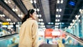 Young asian woman passenger in airport terminal or modern train station Royalty Free Stock Photo