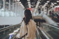 Young asian woman passenger in airport terminal or modern train station Royalty Free Stock Photo