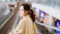 Young asian woman passenger in airport terminal or modern train station Royalty Free Stock Photo