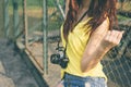 Young asian woman photographer tourist girl posing outdoor