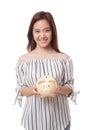 Young Asian woman with a pig coin bank. Royalty Free Stock Photo