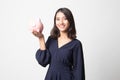 Young Asian woman with a pig coin bank Royalty Free Stock Photo