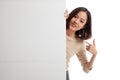 Young Asian woman point to a blank sign Royalty Free Stock Photo