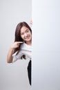 Young Asian woman point to a blank sign. Royalty Free Stock Photo