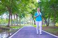 Young Asian woman portrait.She is Jogging in park.