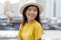 Young asian woman portrait smiling with happiness at city outdoors background, happy moment, casual lifesyle, travel blogger