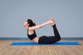 Young asian woman practicing yoga pose Royalty Free Stock Photo