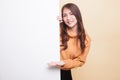 Young Asian woman present blank sign with palm hand.