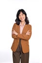 Young asian woman, professional businness entrepreneur in brown suit with arms crossed and smile isolated over white background