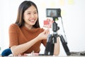 Young Asian woman recording a video for a woman beauty blogger. Makeup Tutorial. Royalty Free Stock Photo