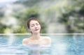 Young woman relaxing in hot springs Royalty Free Stock Photo